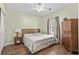 A charming bedroom features wood-look floors, neutral walls and comfortable bedding at 3927 Gladiola Ct. # 101, Myrtle Beach, SC 29588