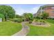 Landscaped courtyard with benches and a grill for outdoor gatherings and relaxation at 3927 Gladiola Ct. # 101, Myrtle Beach, SC 29588