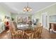 Dining area with a glass table and seating for six, with a view of the backyard at 3927 Gladiola Ct. # 101, Myrtle Beach, SC 29588