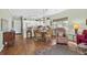 Open-concept living and dining area with hardwood floors and plenty of natural light at 3927 Gladiola Ct. # 101, Myrtle Beach, SC 29588
