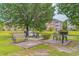 Community grilling area with benches and picnic tables to enjoy outdoor cooking near the pond at 3927 Gladiola Ct. # 101, Myrtle Beach, SC 29588
