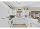 Well-maintained kitchen with white appliances, ample counter space, and decorative accents at 3927 Gladiola Ct. # 101, Myrtle Beach, SC 29588