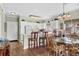 Eat-in kitchen with white cabinets, breakfast bar, and adjacent dining area at 3927 Gladiola Ct. # 101, Myrtle Beach, SC 29588
