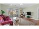 Living room features slider door to porch with a community view at 3927 Gladiola Ct. # 101, Myrtle Beach, SC 29588