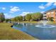 Scenic pond view, community with fountain and lush landscaping at 3927 Gladiola Ct. # 101, Myrtle Beach, SC 29588