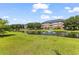 Scenic community pond featuring fountains surrounded by lush landscaping and residential buildings at 3927 Gladiola Ct. # 101, Myrtle Beach, SC 29588