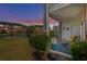 Screened porch overlooking pond and green space, furnished with seating at 3927 Gladiola Ct. # 101, Myrtle Beach, SC 29588