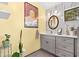 Stylish bathroom featuring a modern vanity, marble wall, and unique decorative accents at 404 66Th Ave. N, Myrtle Beach, SC 29572