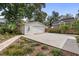 View of detached garage with concrete driveway and landscaping at 404 66Th Ave. N, Myrtle Beach, SC 29572