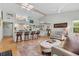 Open-concept living area with hardwood floors, high ceilings, skylights, and a view of the kitchen at 404 66Th Ave. N, Myrtle Beach, SC 29572