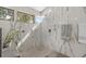 Beautiful walk-in shower with marble tile, rain shower head, and lots of natural light from the window at 404 66Th Ave. N, Myrtle Beach, SC 29572