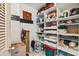 Closet/storage room with lots of shelving, boxes and plastic containers at 404 66Th Ave. N, Myrtle Beach, SC 29572