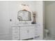 Bright bathroom featuring white cabinets, framed mirrors, and elegant accents at 404 Club Dr., Myrtle Beach, SC 29572