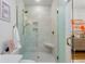 Elegant bathroom featuring a glass enclosed shower, marble walls, and stylish fixtures at 404 Club Dr., Myrtle Beach, SC 29572