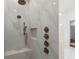 Walk-in shower with bronze fixtures and white marble tiling at 404 Club Dr., Myrtle Beach, SC 29572