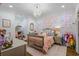 Charming bedroom featuring a floral accent wall, beautiful lighting, and luxury decor at 404 Club Dr., Myrtle Beach, SC 29572