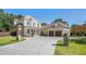 Long driveway leading to a beautiful home with a well-manicured lawn and mature trees at 404 Club Dr., Myrtle Beach, SC 29572