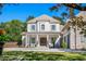 Charming two-story home featuring a symmetrical facade, manicured lawn, and a welcoming covered front porch at 404 Club Dr., Myrtle Beach, SC 29572