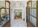 Elegant foyer featuring a marble floor, chandelier, and a view into the spacious living area at 404 Club Dr., Myrtle Beach, SC 29572
