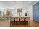 Spacious kitchen featuring a large island, custom cabinets, modern appliances, and hardwood floors at 404 Club Dr., Myrtle Beach, SC 29572