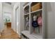 Functional mudroom with built-in storage, bench, hooks, and convenient shoe storage at 404 Club Dr., Myrtle Beach, SC 29572