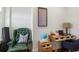 This home office features a leather chair, a wooden desk, and light walls, creating a comfortable work space at 404 Club Dr., Myrtle Beach, SC 29572