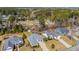 Aerial view showcasing a home surrounded by lush greenery, creating a serene and private setting at 4208 Edgefield Rd., Little River, SC 29566