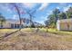 Backyard with firepit and enclosed sunroom, great for outdoor entertaining at 4208 Edgefield Rd., Little River, SC 29566