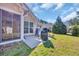 Backyard patio perfect for grilling, with well-manicured lawn at 4208 Edgefield Rd., Little River, SC 29566