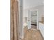 Bright bathroom with a soaking tub and a seamless transition to the bedroom at 4208 Edgefield Rd., Little River, SC 29566