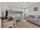 Cozy bedroom features a bunk bed, comfortable seating, and functional desk space at 4208 Edgefield Rd., Little River, SC 29566