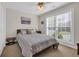 Comfortable bedroom with a ceiling fan, natural light, and neutral decor at 4208 Edgefield Rd., Little River, SC 29566
