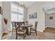 Cozy dining area featuring a modern chandelier and large window at 4208 Edgefield Rd., Little River, SC 29566