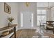 Inviting foyer with hardwood floors, stylish console table, and contemporary lighting at 4208 Edgefield Rd., Little River, SC 29566