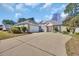 Lovely one-story brick house with an attached garage and a wide concrete driveway at 4208 Edgefield Rd., Little River, SC 29566