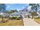Charming single-story brick home with manicured landscaping and a spacious driveway at 4208 Edgefield Rd., Little River, SC 29566