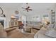 Open-concept living room with a fireplace and views into the dining area at 4208 Edgefield Rd., Little River, SC 29566