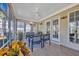 Sunroom with tile floors, ceiling fan, and outdoor access doors adds living space and comfort at 4208 Edgefield Rd., Little River, SC 29566