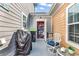 Back patio featuring seating, BBQ, and access to a beach house storage room at 4350 Grande Harbour Blvd., Little River, SC 29566
