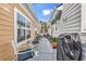 Backyard with furniture and BBQ between two houses at 4350 Grande Harbour Blvd., Little River, SC 29566