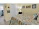 Bright bedroom featuring coastal decor, a bed with patterned quilt, and closet at 4350 Grande Harbour Blvd., Little River, SC 29566