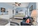 Relaxing blue bedroom featuring coastal decor and a cozy seating area at 4350 Grande Harbour Blvd., Little River, SC 29566