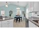 Well-lit kitchen featuring granite countertops, stainless steel appliances, and an adjacent dining area at 4350 Grande Harbour Blvd., Little River, SC 29566