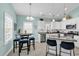 Stylish kitchen featuring white cabinets, granite countertops, stainless steel appliances, and breakfast bar seating at 4350 Grande Harbour Blvd., Little River, SC 29566