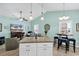 Open-concept living space with kitchen island, tile floors, and comfortable seating; ideal for entertaining at 4350 Grande Harbour Blvd., Little River, SC 29566