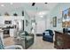 Inviting living room with blue accent chairs and an open view of the kitchen and entryway at 4350 Grande Harbour Blvd., Little River, SC 29566
