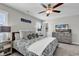 Comfortable primary bedroom with a ceiling fan, a TV, and a closet for storage at 4350 Grande Harbour Blvd., Little River, SC 29566