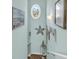Well-lit staircase with a nautical-themed decor, featuring decorative wall art, and a small window at 4350 Grande Harbour Blvd., Little River, SC 29566