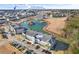 A picturesque aerial view of the condominium complex, showcasing its serene water and community boat dock location at 4503 W Harbour Ct. # S-12, Little River, SC 29566