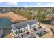 An overhead shot of a condominium complex by a lake, highlighting the parking area and surrounding trees at 4503 W Harbour Ct. # S-12, Little River, SC 29566